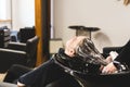 Master woman hairdresser washes hair of a girl with shampoo before styling in a beauty salon. Royalty Free Stock Photo