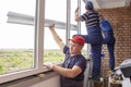 Master workers install window sill repair in house building Asians Royalty Free Stock Photo