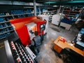 Master workers work on modern machines for checking rubber tubes.