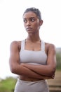 Master your mindset, and youll master your body. a sporty young woman standing with her arms crossed outdoors.