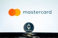 Mastercard logo with Ethereum coin Royalty Free Stock Photo