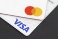 Mastercard and Visa credit cards close up. Two white contactless payment cards closeup. Selective focus Royalty Free Stock Photo