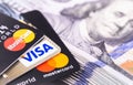 MasterCard, Visa and dollars banknotes Royalty Free Stock Photo