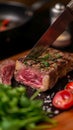 Masterful cut Chef skillfully slices through a substantial beef piece