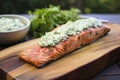 Masterfully prepared salmon, arranged on a cedar board.