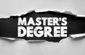 MASTERS DEGREE text in bold cracked font revealed through torn paper background. Conceptual education message for higher learning Royalty Free Stock Photo