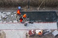 The masters lays paving stones. Sidewalk Repair. Aerial View Royalty Free Stock Photo