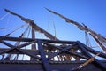 Masts and furled sails on an old wooden sailing ship