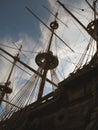 The masts of an old sailboat against the blue sky. Pirate ship masts close up Royalty Free Stock Photo