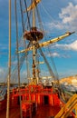 Masts and rigging of an old wooden sailboat. Details deck of the ship Royalty Free Stock Photo