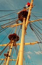 Masts and rigging of an old wooden sailboat. Details deck of the ship Royalty Free Stock Photo