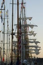 Masts, rigging and yards of tall ships at sunset