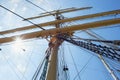 Masts of a sailing ship with the lowered sails. Royalty Free Stock Photo