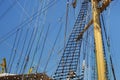 Masts of a sailing ship with the lowered sails. Royalty Free Stock Photo