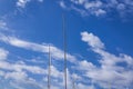 Masts Of Sailing Ships Yacht On Blue Sky Background In Marina