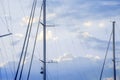 Masts of sailing yachts against the blue sky Royalty Free Stock Photo