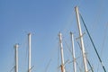 Masts tops and rope rigging accessory on yachts sailing vessels in the marina Royalty Free Stock Photo