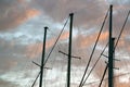 Masts Of A Yacht Without Sails Against The Backdrop Of A Sunset Stormy Sky