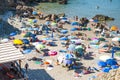 Masua Beach, Italy - August 19: Masua Beach in Nebida crowed in Royalty Free Stock Photo