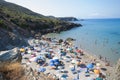 Masua Beach, Italy - August 19: Masua Beach in Nebida crowed in Royalty Free Stock Photo