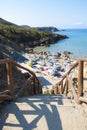 Masua Beach, Italy - August 19: Masua Beach in Nebida crowed in Royalty Free Stock Photo