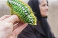 Close Up view of a small woolen socks with blurred woman