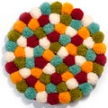 Mat of pompons made from multi-colored handmade yarn Royalty Free Stock Photo