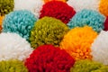 Mat of pompons made from multi-colored handmade yarn Royalty Free Stock Photo