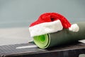 Mat with Santa Clause hat at gym Royalty Free Stock Photo
