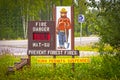 Mat-Su Alaska USA - Smokey Bear - Prevent Forest Fires sign beside Alaskan highway - Extreme Level - Burn Permits Royalty Free Stock Photo