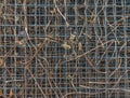 Matal industry grid fence pattern with natural brown weeds