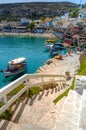 Wooden fishing boats at Matala beach with caves on the rocks, Crete, Greece. Royalty Free Stock Photo