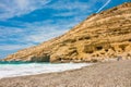 Matala, beautiful beach on Crete island, waves and rocks. Royalty Free Stock Photo