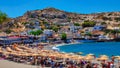 Vacationers relax on Matala Beach on the Greek island of Crete