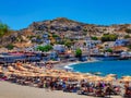 Matala, Greece - August 14, 2020 - Vacationers relax on Matala Beach on the island of Crete