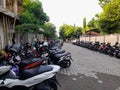 Mataram city, Lombok island, March 18; 2023: Rows of motorbikes parked in parking lot in the city of Mataram, Indonesia
