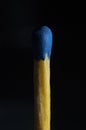 Match with a blue head isolated on a dark background Royalty Free Stock Photo