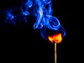 A match catching fire and burning Royalty Free Stock Photo
