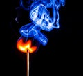 A match catching fire and burning Royalty Free Stock Photo