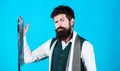 Match colors. Man bearded hipster hold few neckties on blue background. Guy with beard choosing necktie. Perfect necktie