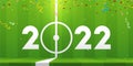 Happy New Year 2022 banner with soccer ball and paper confetti on soccer field background. Banner template design for 2022. Royalty Free Stock Photo