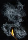 match with fire and smoke Royalty Free Stock Photo