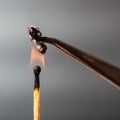 Match flame ignites cotton threads