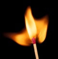 Match flame over black background, close up Macro fire burning on matchstick. Wooden matches with red sulfur heads, fire ignition Royalty Free Stock Photo