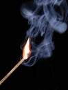 Match flame and smoke on black background Royalty Free Stock Photo