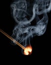 Match flame and smoke on black background Royalty Free Stock Photo