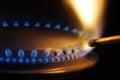 Match lightening a gas stove Royalty Free Stock Photo