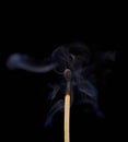 Match off on a black background with smoke Royalty Free Stock Photo