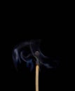 Match off on a black background with smoke Royalty Free Stock Photo