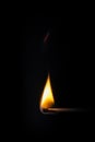 match stick flame in front of a black background Royalty Free Stock Photo